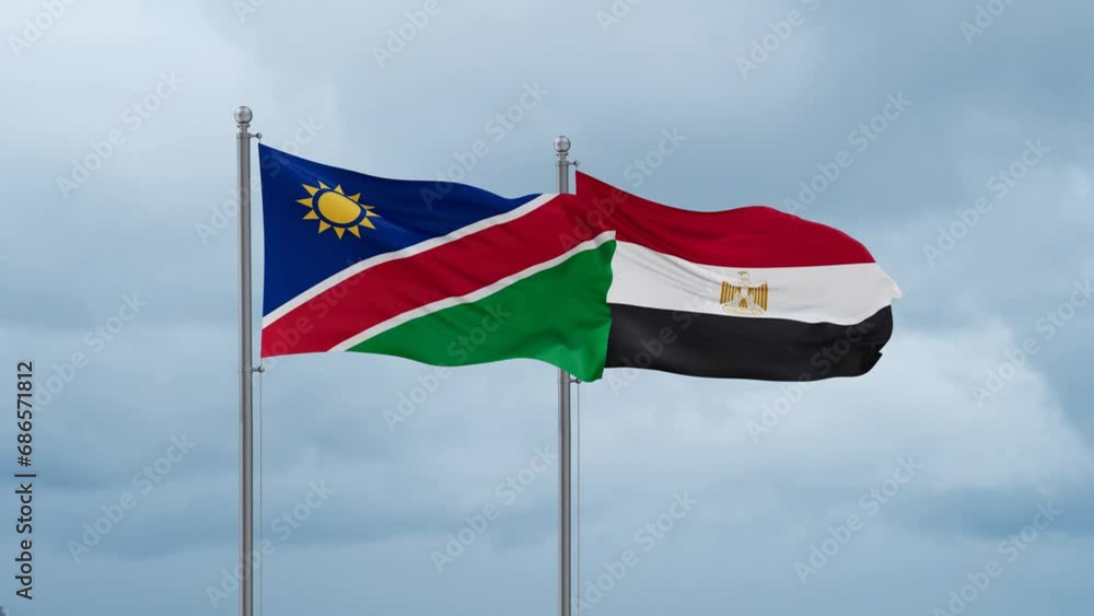 Egypt flag and Namibia flag waving together on cloudy sky, endless seamless loop, two country relations concept Egypt flag and Namibia flag waving together on cloudy sky, endless seamless loop, two country relations concept