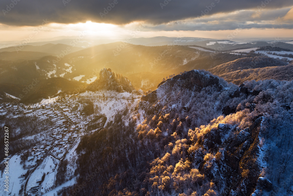 Fantastic winter landscape during sunset. colorful sky glowing by sunlight. Dramatic wintry scene. snow covered trees under warm sunlit. Sunlight sparkling in the snow. Splendid Alpine winter