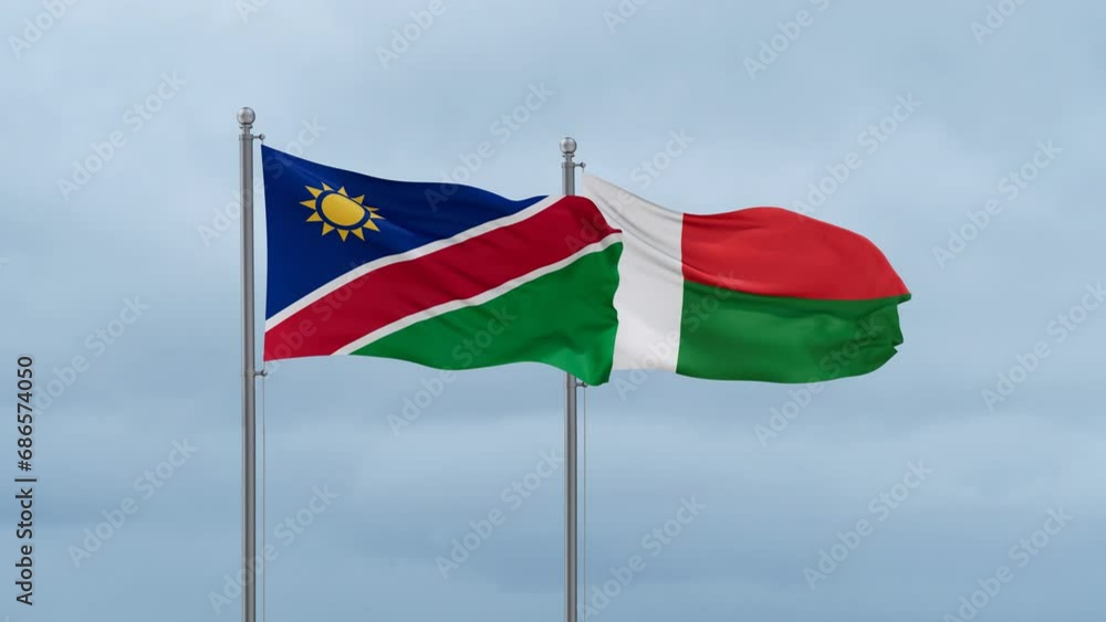 Madagascar flag and Namibia flag waving together on cloudy sky, endless seamless loop, two country relations concept Madagascar flag and Namibia flag waving together on cloudy sky, endless seamless loop, two country relations concept