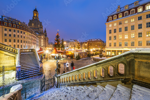Traditional Christmas market called Weihnachtsmarkt on the Neumarkt square in Dresden Germany in blue hour. photo