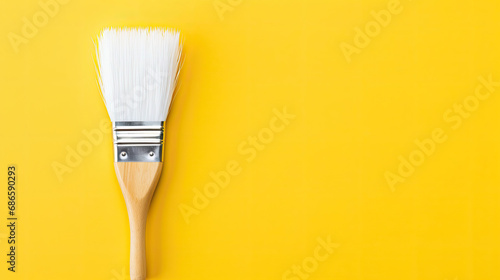 paint brush on a yellow background , copy space for text