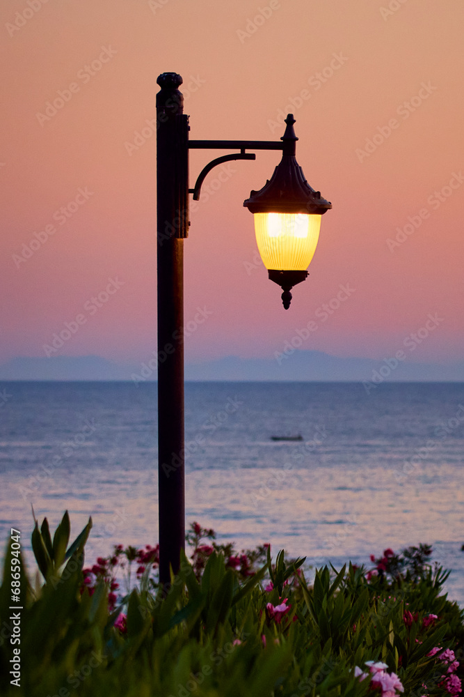 street light pole with lit lantern