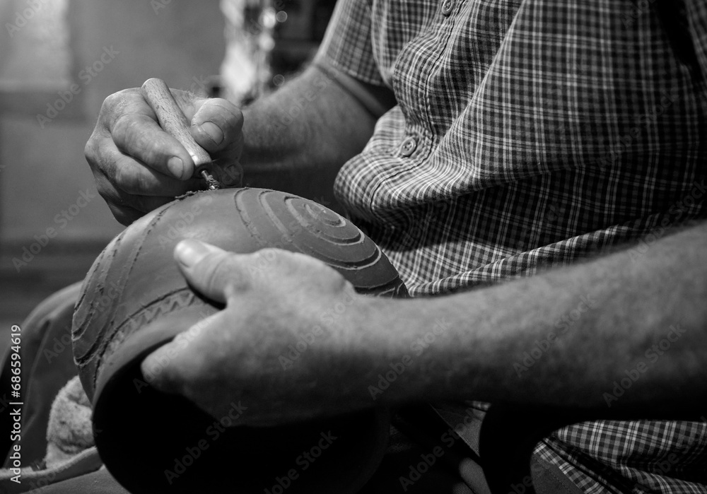 master potter while modeling Vadastra Ceramica clay vessels