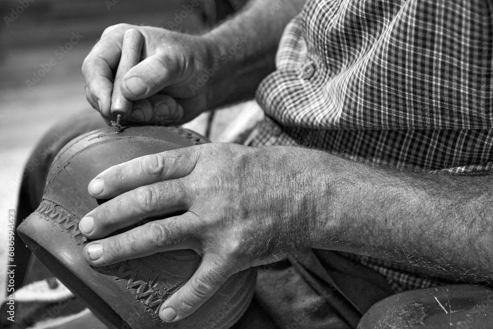 master potter while modeling Vadastra Ceramica clay vessels