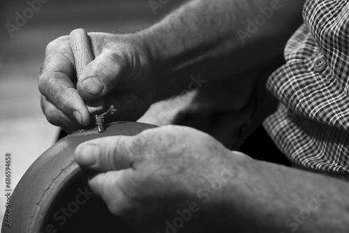 master potter while modeling Vadastra Ceramica clay vessels photo