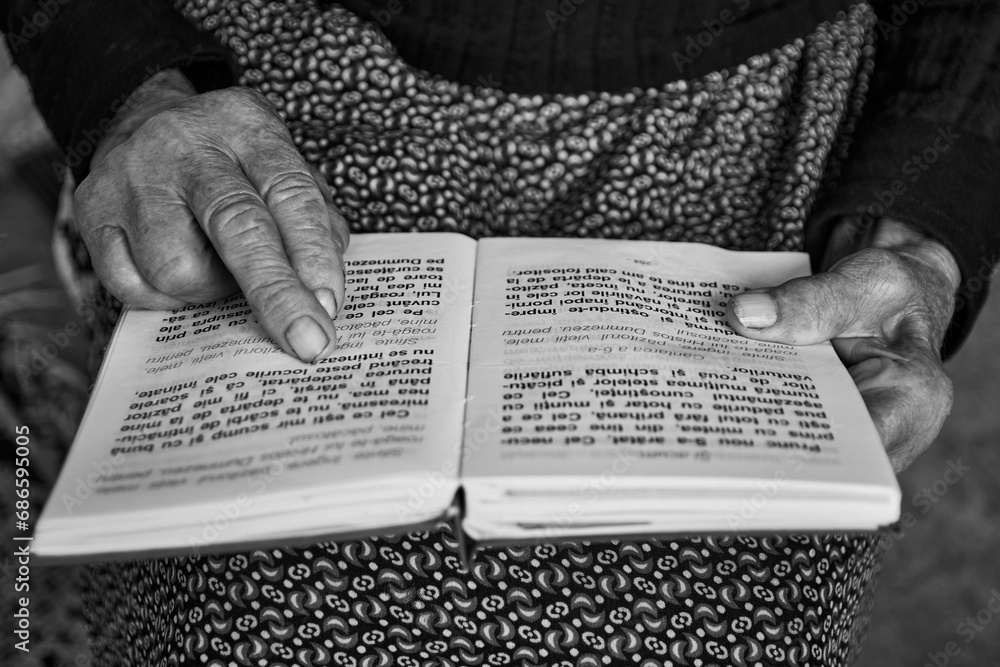 the old woman reading a prayer book