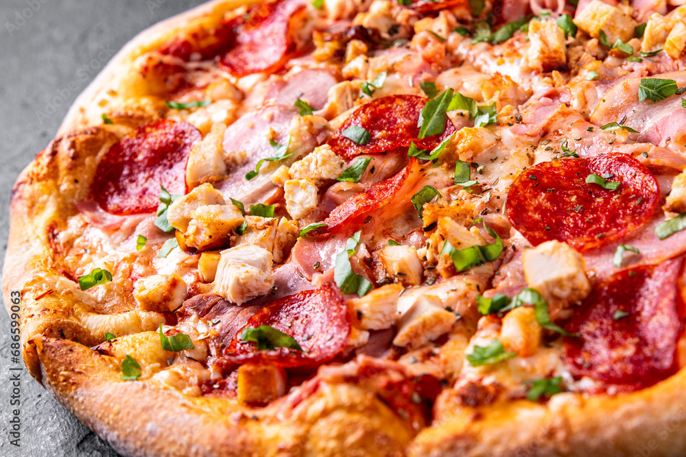 Pizza with Mozzarella cheese, salami, chicken meat, beef, ham, Tomato sauce, pepper, spices. Pizza with Mozzarella cheese, salami, chicken meat, beef, ham, Tomato sauce, pepper, spices.