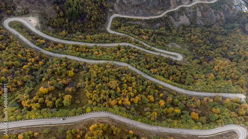 the road running serpentines in the autumn mountains © Павел Чигирь