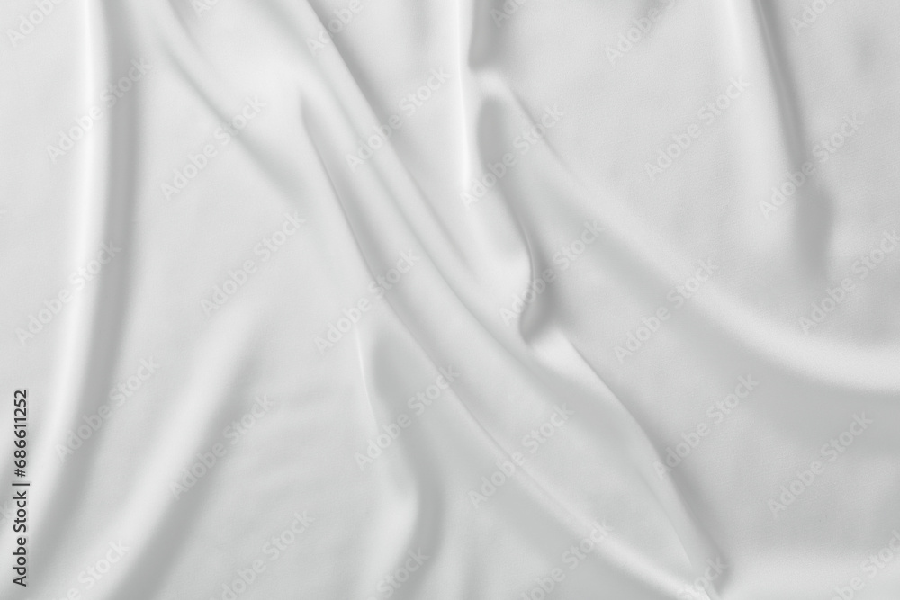 Fototapeta premium Texture of white silk ripple fabric as background, top view