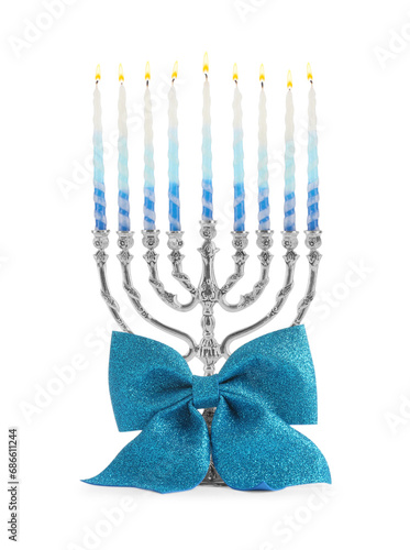 Fototapeta Naklejka Na Ścianę i Meble -  Hanukkah celebration. Menorah with colorful candles and bow isolated on white