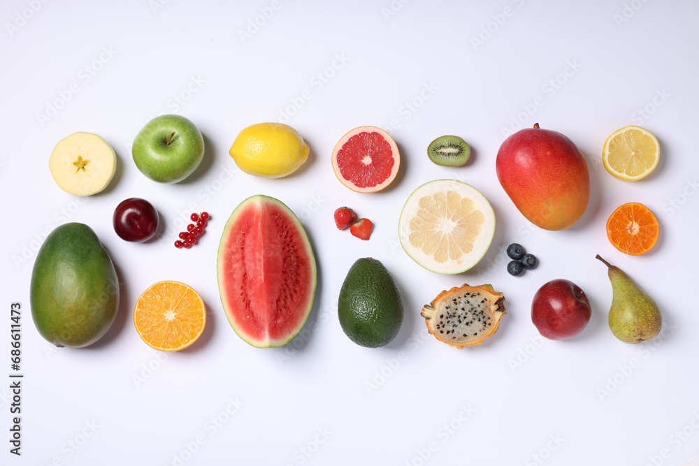 Different ripe fruits and berries on white background, top view Different ripe fruits and berries on white background, top view