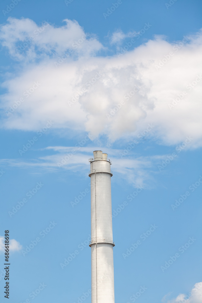 Thermal power plant stack releasing flue gases into the atmosphere Thermal power plant stack releasing flue gases into the atmosphere