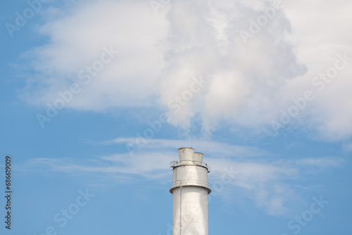 Thermal power plant stack emitting flue gases into the atmosphere