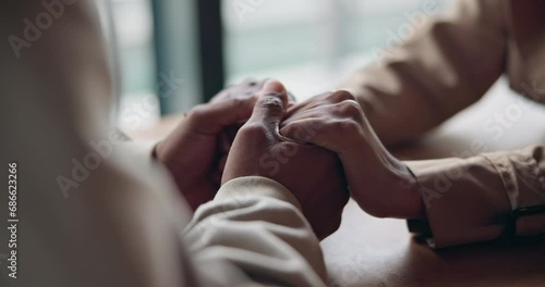 Holding hands, support and couple at table for love, trust and care together after cancer diagnosis. Closeup, man comfort woman and empathy, help in crisis and kindness, connection and hope for faith photo