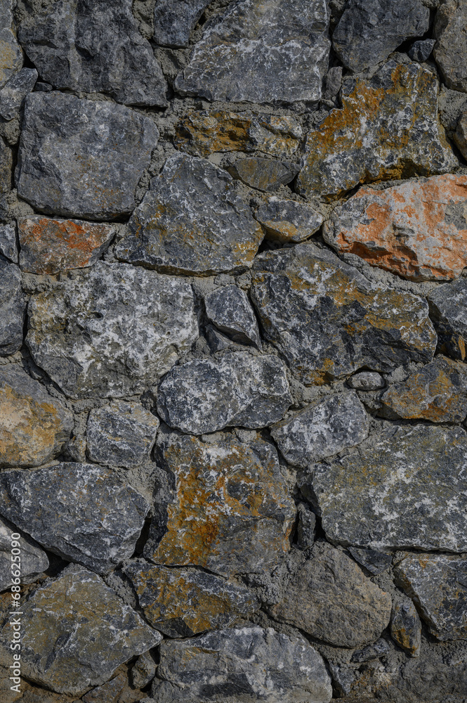fence made of real stone in large pieces as a background 2