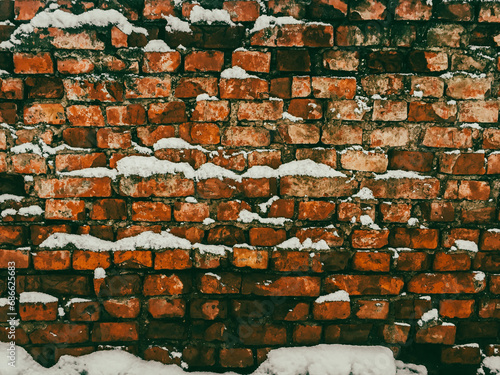 Brick wall dusted with snow