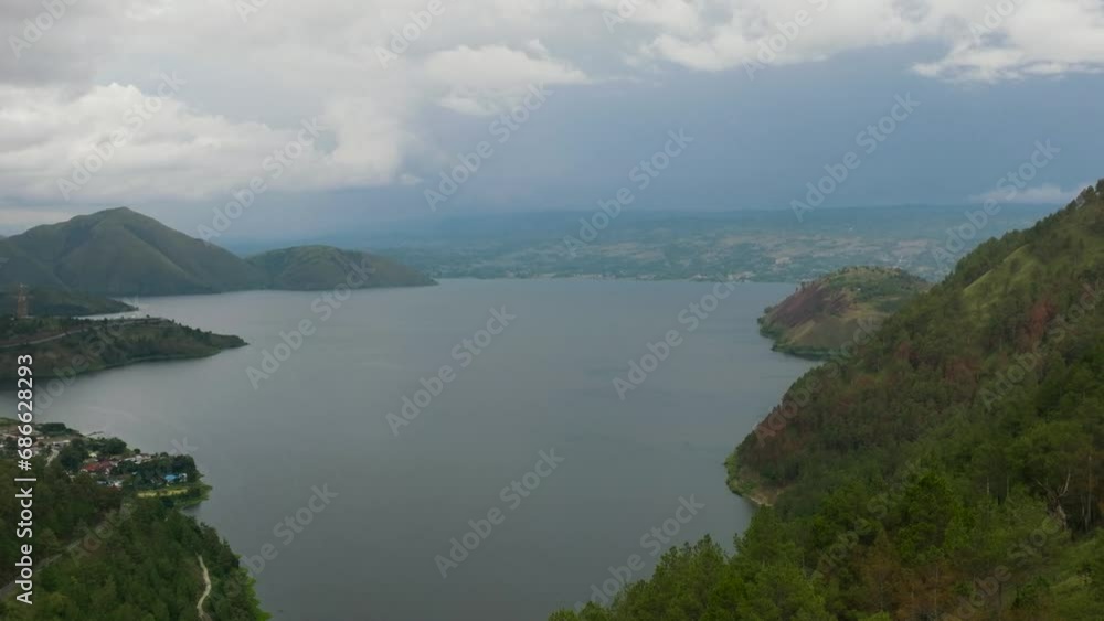 Samosir Island, is a large volcanic island in Lake Toba. Sumatra, Indonesia. Samosir Island, is a large volcanic island in Lake Toba. Sumatra, Indonesia.