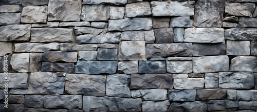 Texture of a strong stone wall used as background in a closeup shot