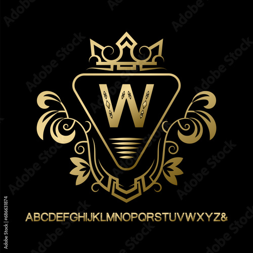 Golden vintage monogram and set of capital letters alphabet. Gold letter framed in patterned frame with crown on black.