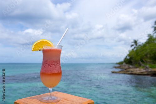 Travel background with drinks Bocal on Caribbean beach.