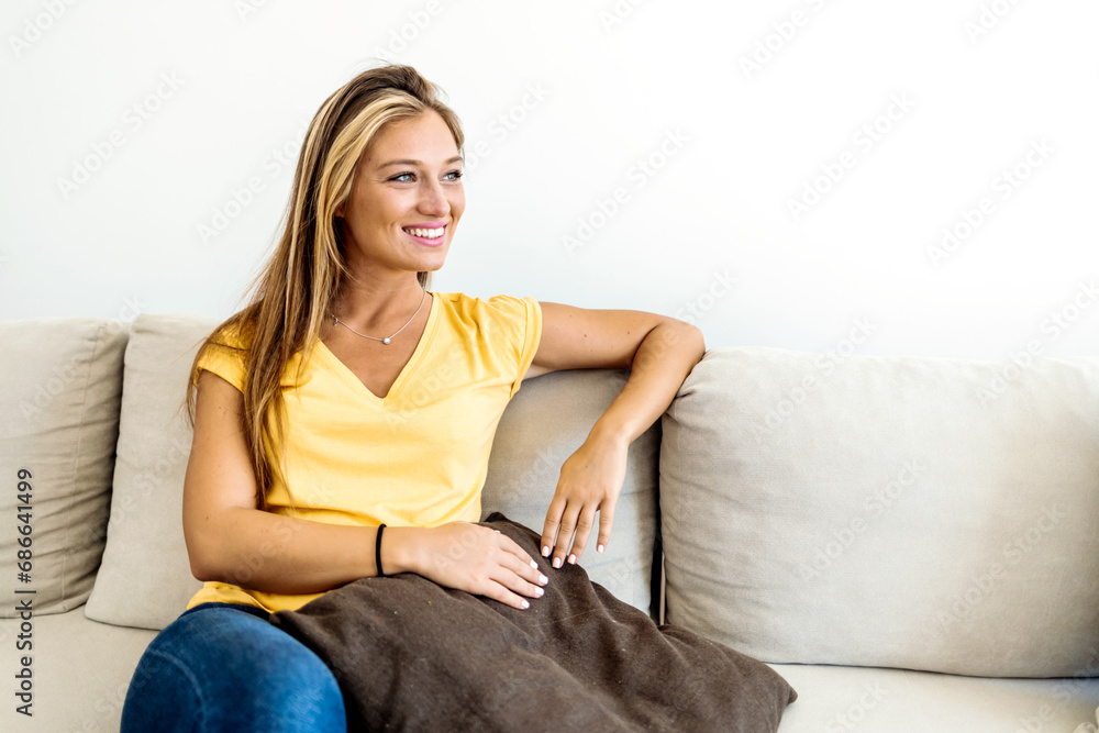 Relaxed serene pretty young woman feel fatigue lounge on comfortable sofa, rest at home. Relaxed serene pretty young woman feel fatigue lounge on comfortable sofa, rest at home.