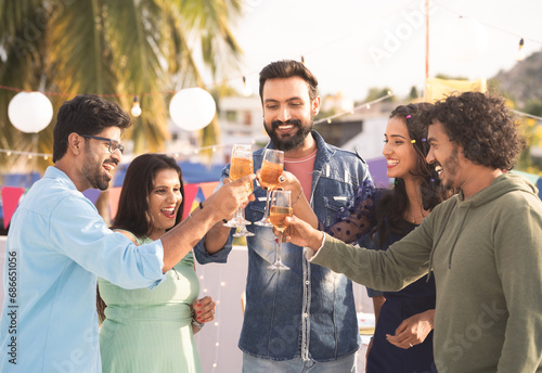 Wall Mural Group of friends at party champagnes glasses at party during new year evening pa