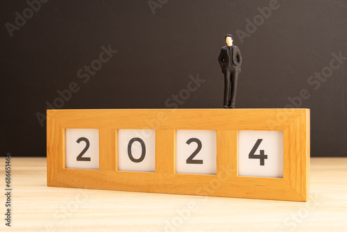2024 year Business plan concept. Human Figurine on 2024 sign. Copy space