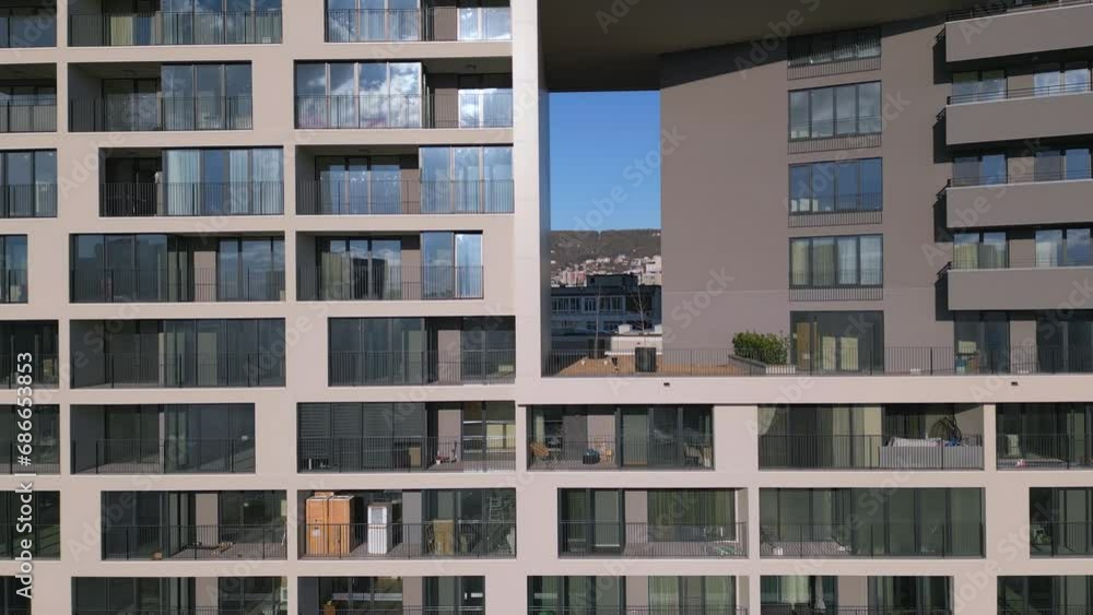 Drone flight along the facade of a modern office or residential building background Drone flight along the facade of a modern office or residential building background