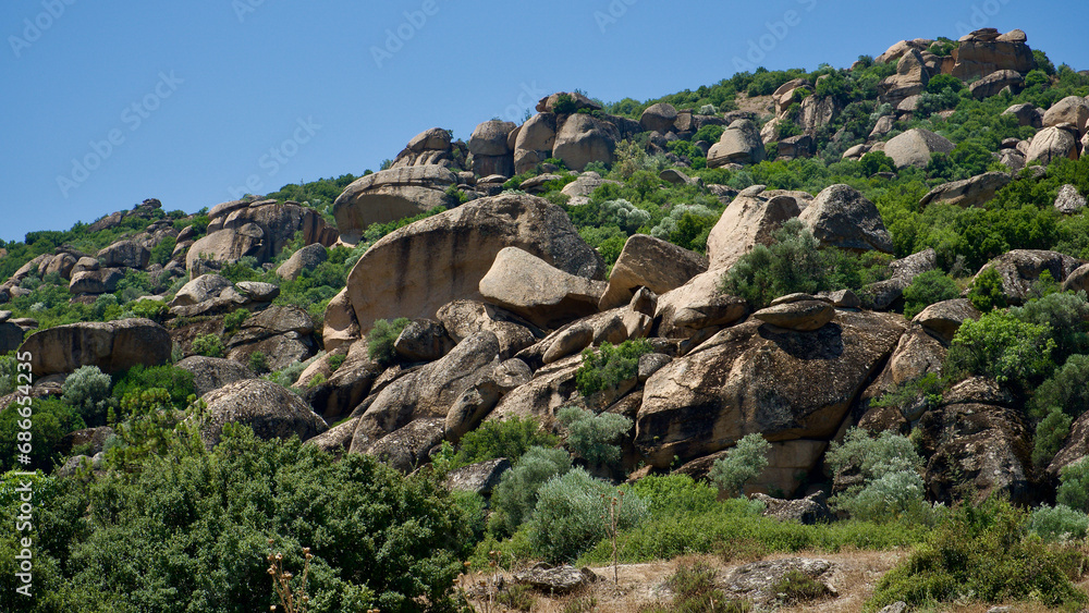 Lime rock formations on the Aegean coast in western Turkey. Volcanic lime rocks shaped by erosion. Naturally shaped sandwich rock formations.