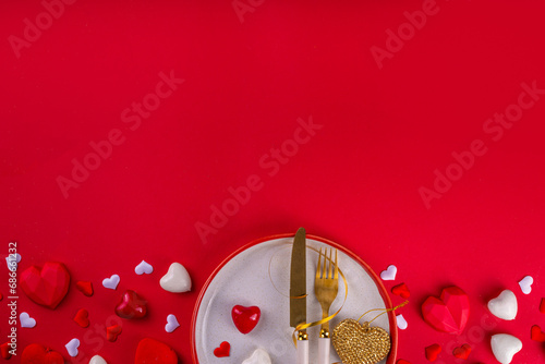 Valentine day  table setting background table setting for romantic dinner on red background, top view. Valentine's day celebration menu, greeting card or invitation background, Galentine day flat lay photo