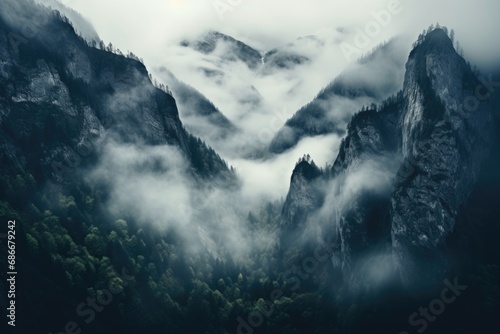 A majestic mountain covered in thick fog and clouds.  photo