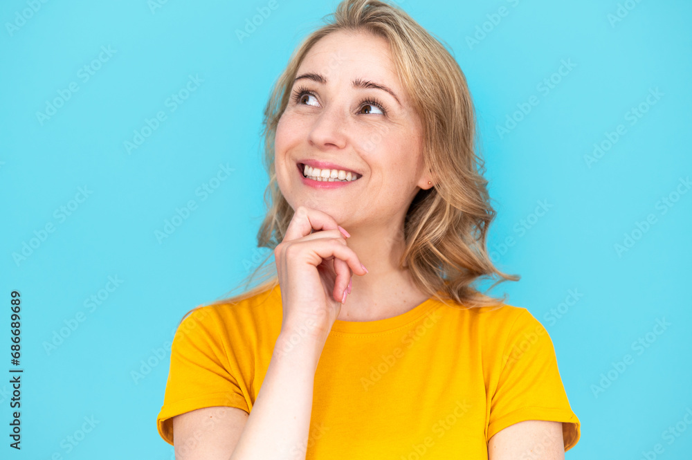 Dreamy woman thinking or imagination on blue background Dreamy woman thinking or imagination on blue background