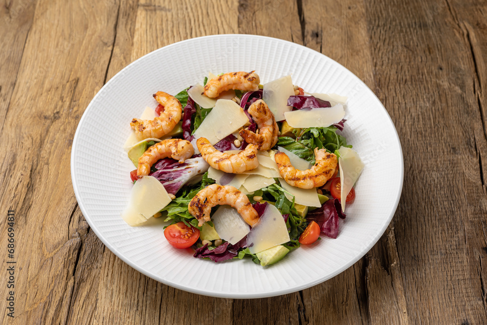 Delicious salad with shrimp, parmesan and cherry tomatoes Delicious salad with shrimp, parmesan and cherry tomatoes