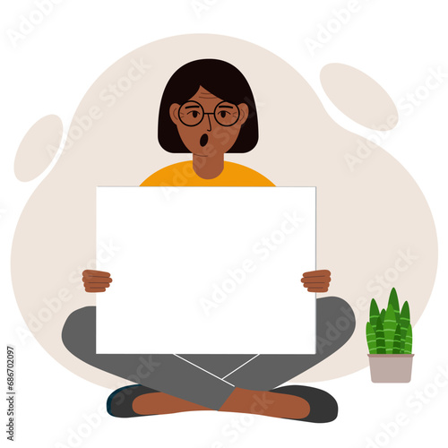 A woman sits cross-legged and holds a large white sheet with space for text. Advertising, poster, information, announcement.