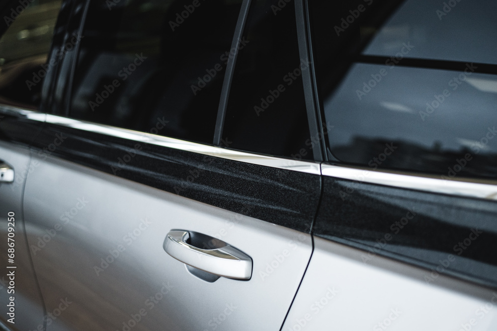 door handle of a new silver car