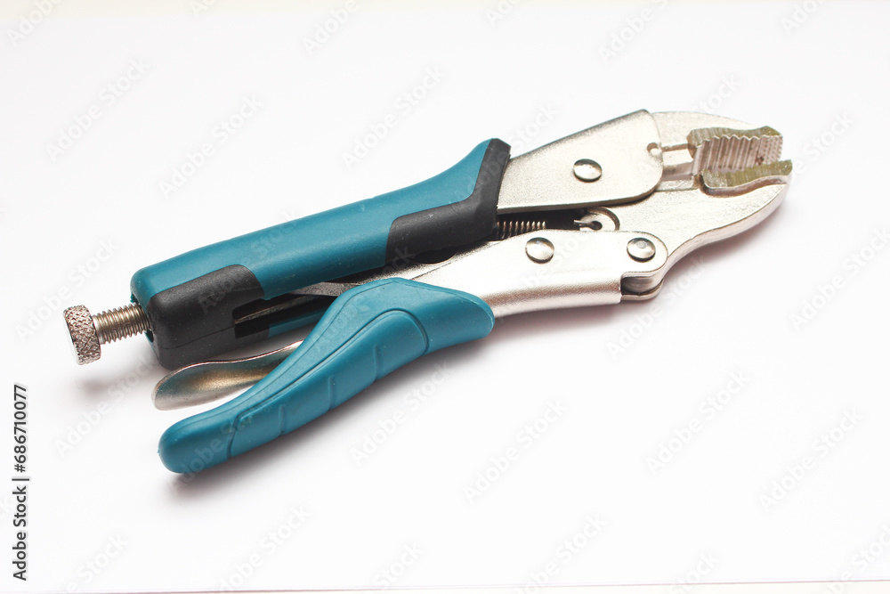 Tools for pliers on a white background, close-up. Tools for pliers on a white background, close-up.