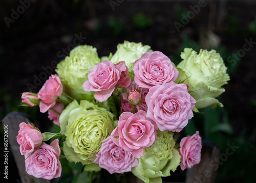 Bouquet of beautiful fresh pink and green roses close up. Mother s Day  International Women s Day  Valentine s Day. Floral surprise from with love. Flower delivery