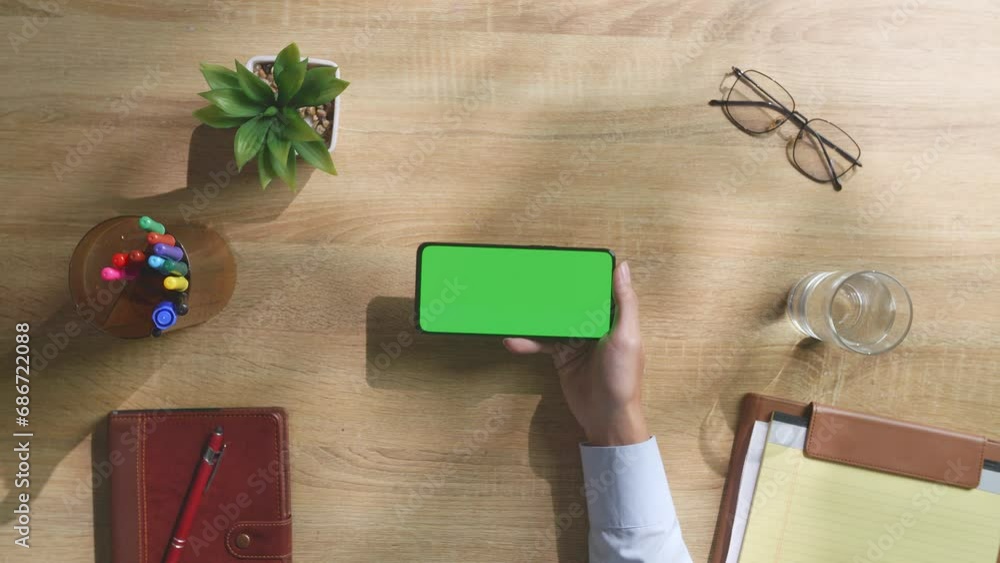 Top Down View Of Man'S Hands Holding Smartphone With Mock Up Green ...