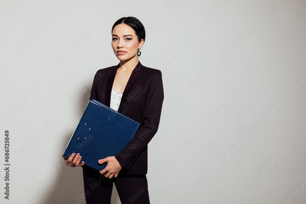 Business beautiful woman in brown business suit in office Business beautiful woman in brown business suit in office