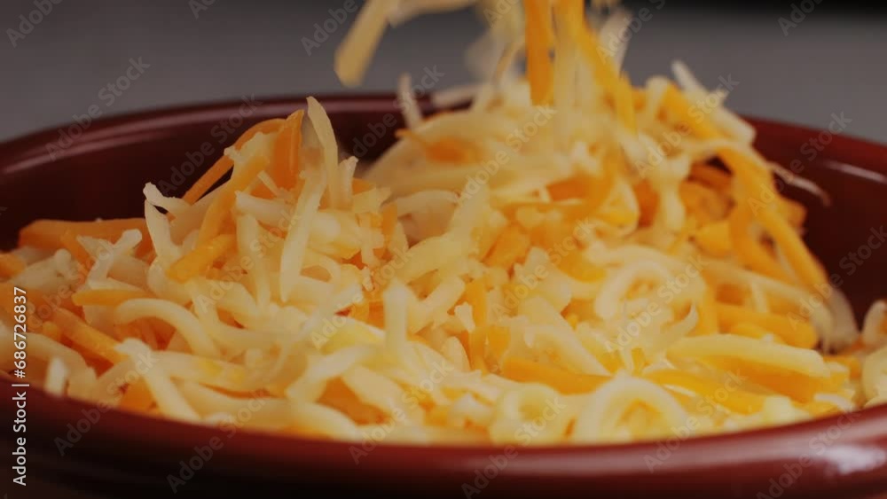 Some different sorts of grate cheese on plate close up macro. Chef grating cheese mozzarella, cheddar for meals. Itallian food, pizza, pasta. Some different sorts of grate cheese on plate close up macro. Chef grating cheese mozzarella, cheddar for meals. Itallian food, pizza, pasta.