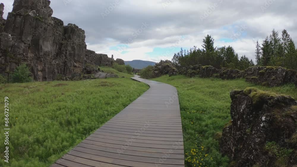 SLOW MOTION - Almannagja is an eight-kilometer-long gorge within Pingvellir National Park, which marks the edge of the North American plate and the beginning of the Þingvellir rift valley in Iceland. SLOW MOTION - Almannagja is an eight-kilometer-long gorge within Pingvellir National Park, which marks the edge of the North American plate and the beginning of the Þingvellir rift valley in Iceland.