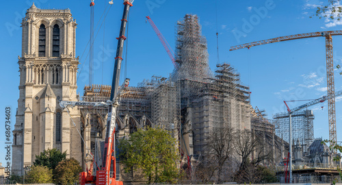 Paris, France - 11 30 2023: Notre Dame de Paris. Panoramic view of the renovation site with scaffolding and the new steeple.