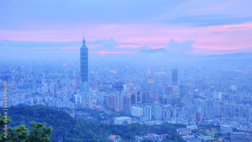 Naklejka premium Panoramic aerial view of Downtown Taipei City at dusk, with Taipei 101 Tower in Xinyi Commercial District ~A romantic evening in Taipei, capital city of Taiwan, with dramatic rosy afterglow in the sky