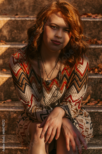 woman sitting on stone steps