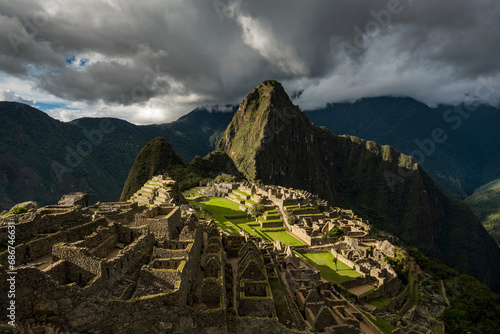 Inca ruins of Machu Picchu with reconstructed stone buildings; Peru photo