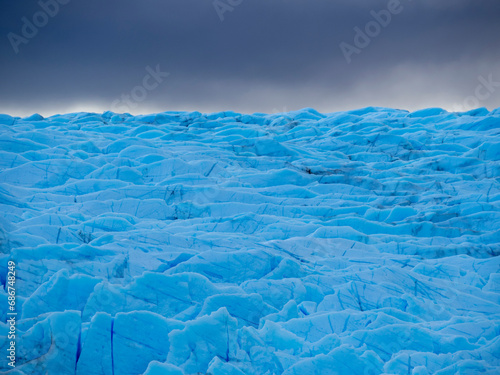 Blue ice from Grey Glacier that comes down from the third largest ice field, the southern Patagonian ice field in Torres del Paine National Park; Patagonia, Chile photo