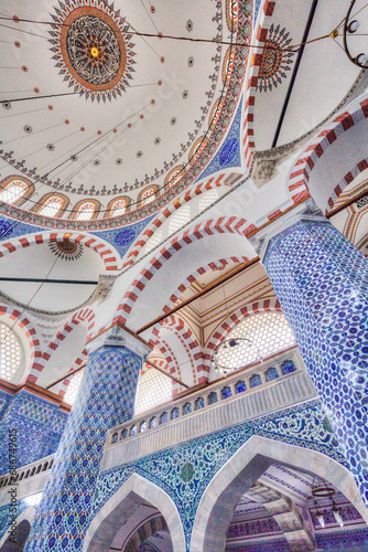 Close-up interior of the Rustem Pasha Mosque with its blue and white Iznik tiles and domed ceiling; Istanbul, Turkey photo