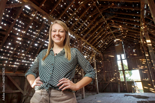 Portrait of a teenage girl in an old barn; Dunbar, Nebraska, United States of America photo