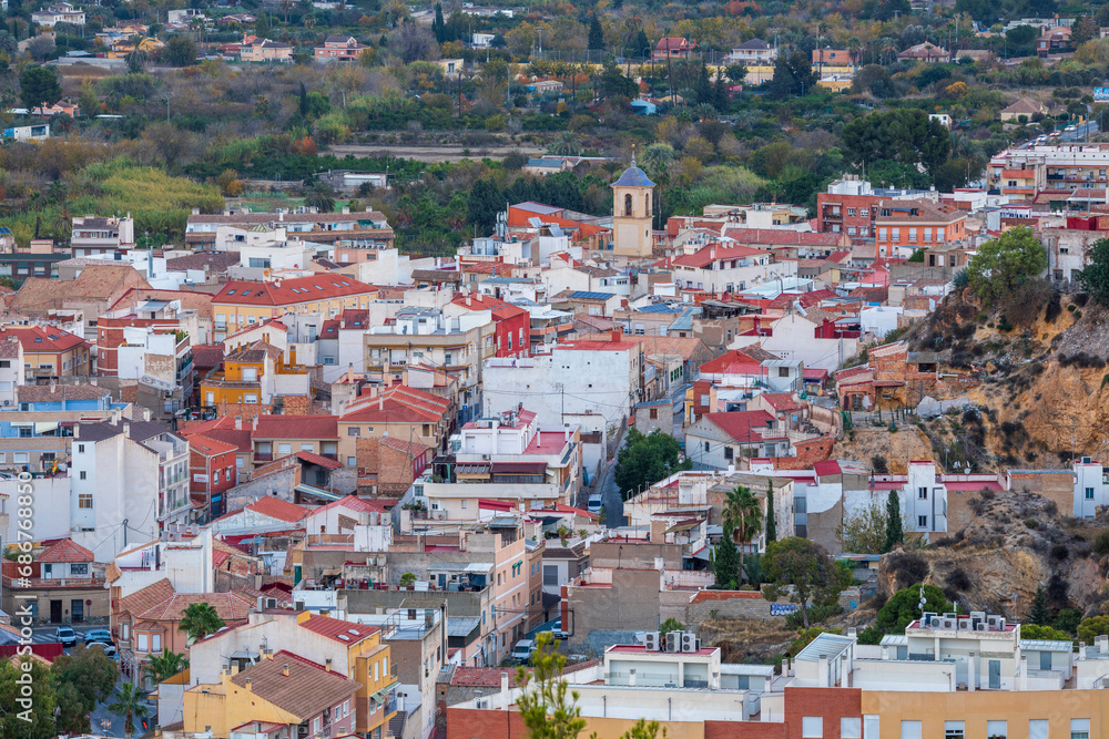 Generic view of the village Algezares in the orchard of Murcia, Spain, at dawn with the church tower protruding