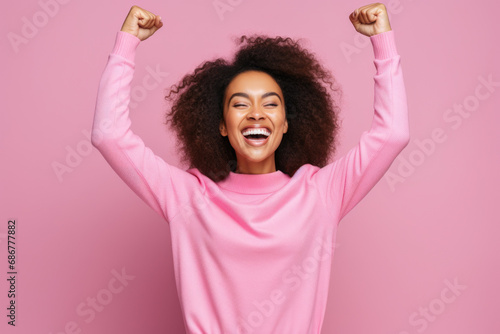 Portrait of delighted funky person raise fists attainment luck shout yes hooray isolated on pink color background photo